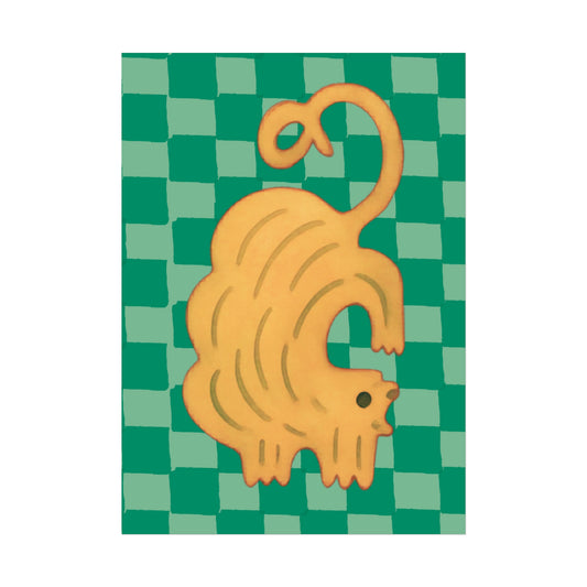 Yellow cat-shaped object on a green checkered background