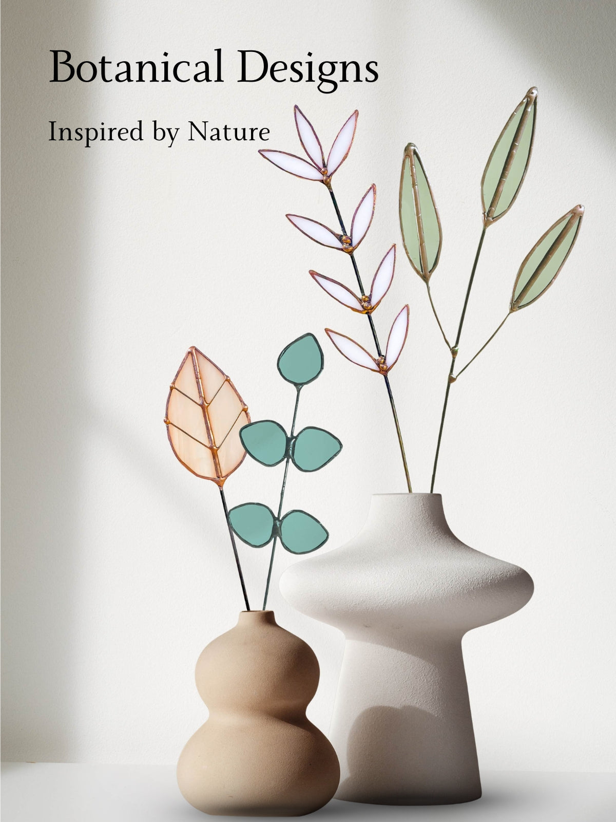 Handmade stained glass botanical stems displayed in modern ceramic vases, nature-inspired glass art collection by Samara Designs Studio