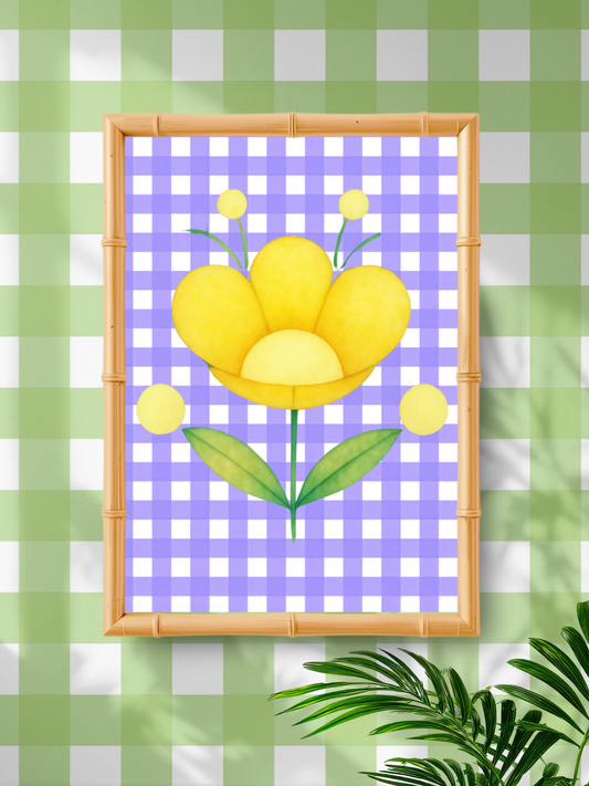 Framed artwork of a yellow flower on a purple checkered background against a green and white checkered wall.