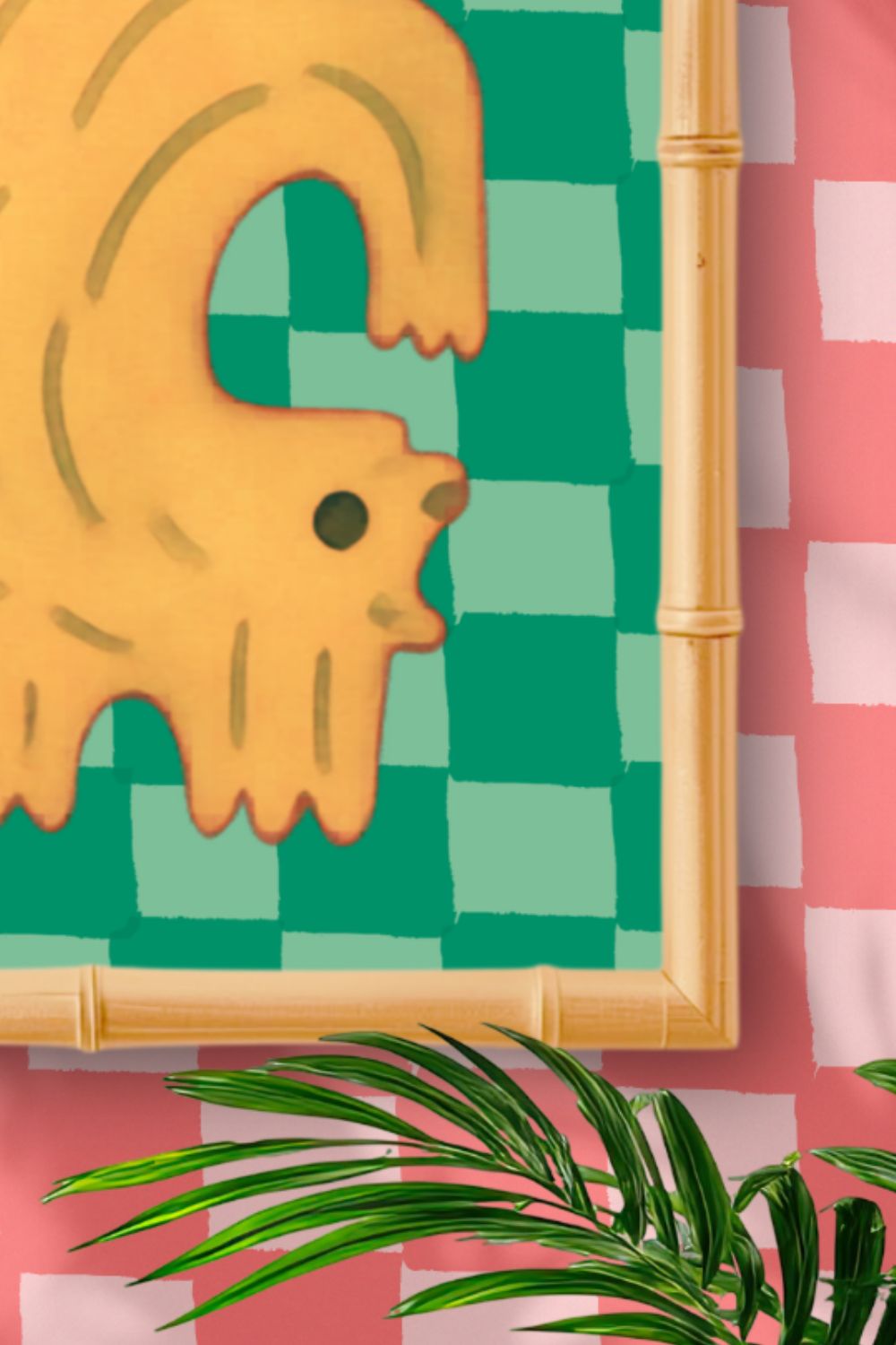 Framed abstract art with a yellow creature on a green checkered background, on a pink and white striped wall.