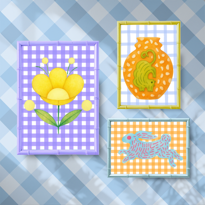 Three colorful framed artworks on a checkered background