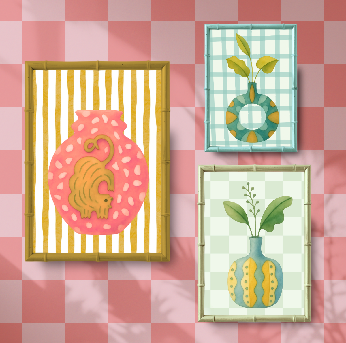 Three framed artworks on a pink checkered background