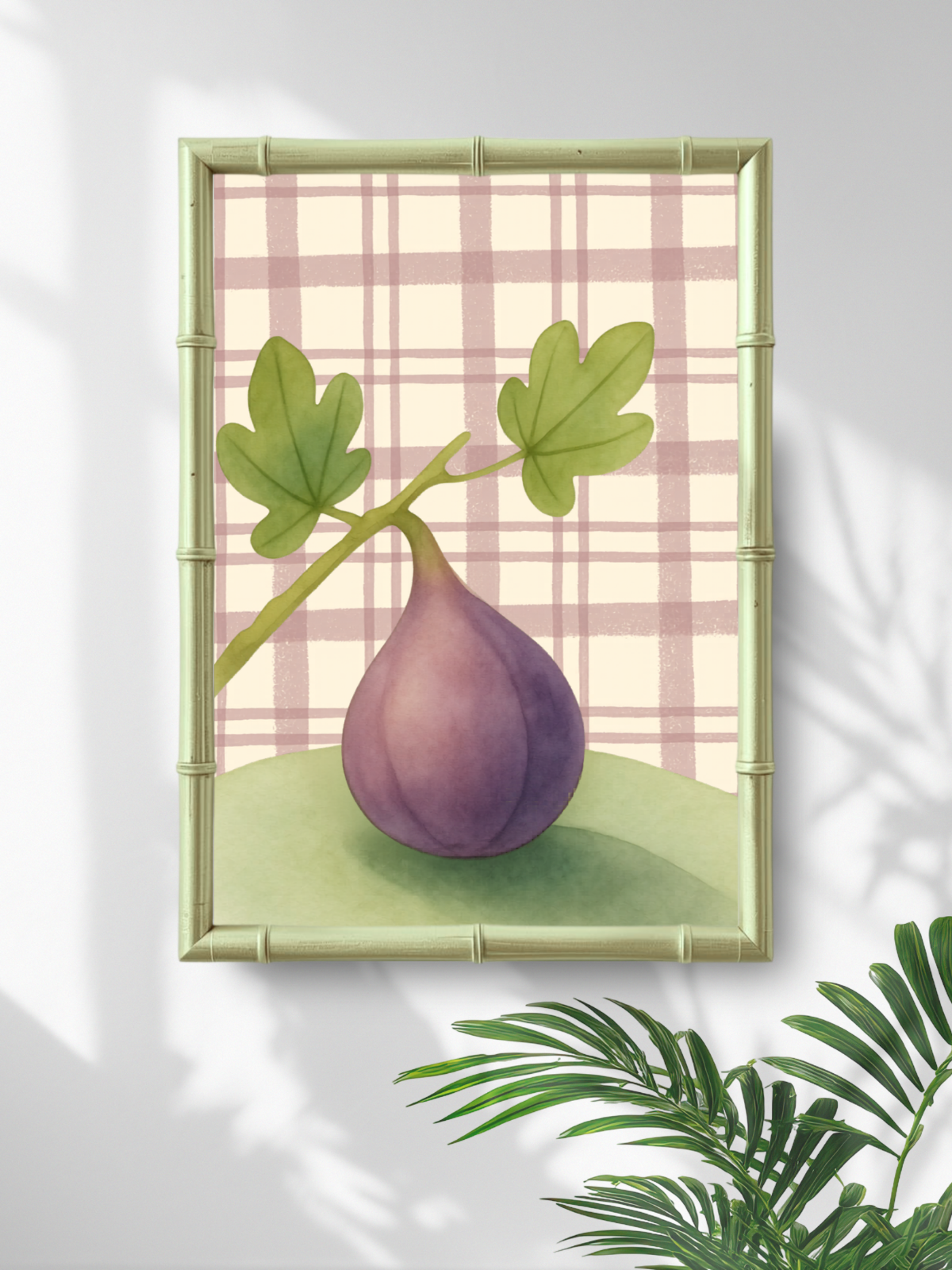 Framed artwork of a purple fig with green leaves on a plaid background