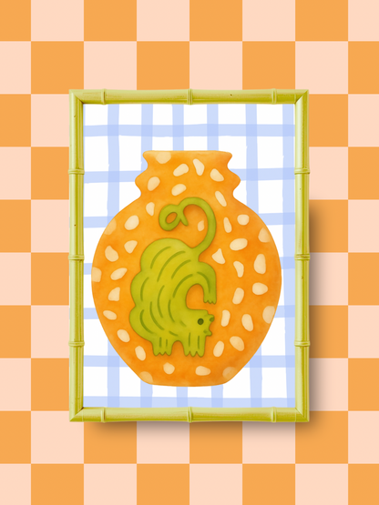 Decorative artwork with a green an ochre colored cat design on an orange vase against a checkered background