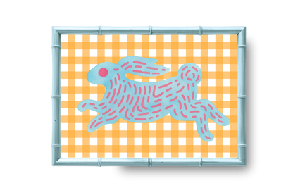 Framed artwork of a blue rabbit on a yellow checkered background